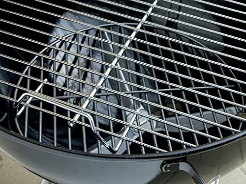 Close-up of a charcoal grill with metal grate.