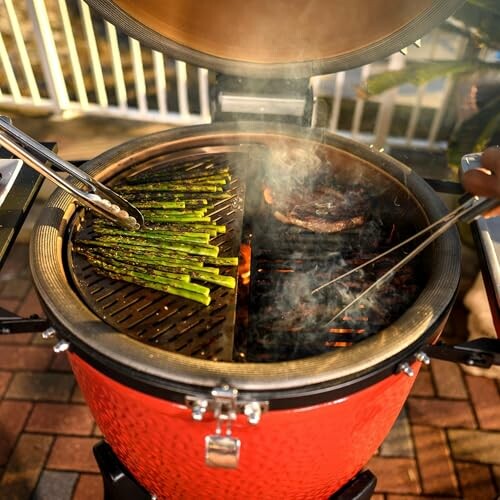 Asparagus and steak grilling on a round barbecue.