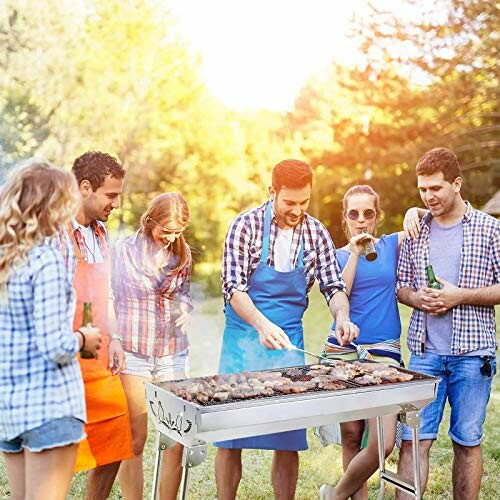 Group of friends enjoying a barbecue outdoors.