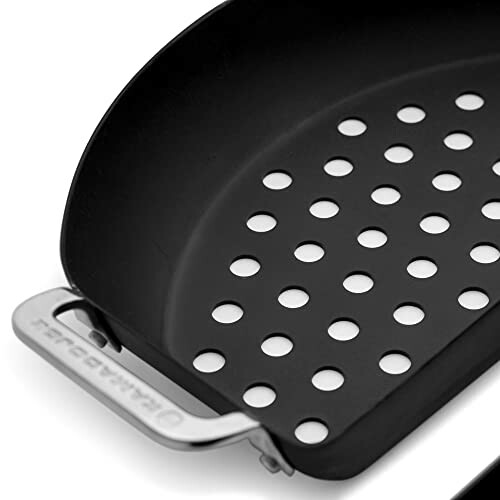 Nonstick grill pan with perforated surface and handle.