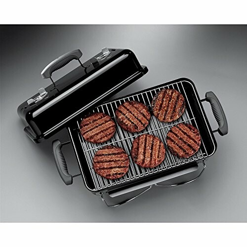 Portable grill with six grilled burger patties.