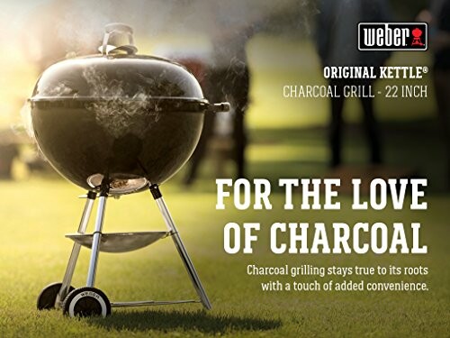 Weber Original Kettle charcoal grill on grass with sunlight